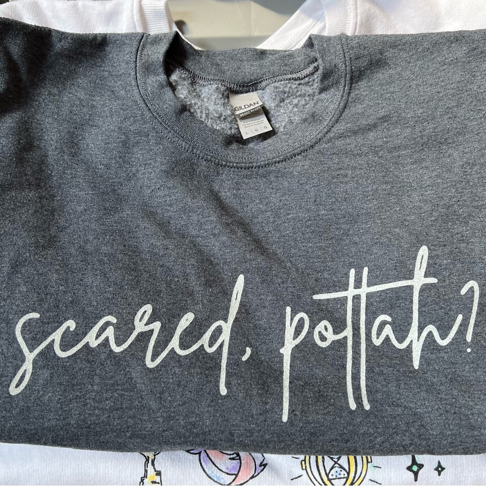 gray sweatshirt “scared, pottah?”